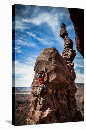 A Male Climber on the Third Pitch of Classic Tower Climb Ancient Art, Fisher Towers, Moab, Utah-Dan Holz-Stretched Canvas