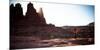 A Male Hiker Enjoys the Rising Sun's Warmth at Fisher Towers in Moab, Utah-Dan Holz-Mounted Photographic Print