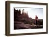 A Male Hiker Enjoys the Rising Sun's Warmth at Fisher Towers in Moab, Utah-Dan Holz-Framed Photographic Print