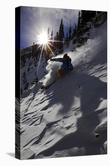 A Male Skier Travels Down the Mountain at Snowbird, Utah-Adam Barker-Stretched Canvas