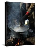 A Man, 24, from Ghana, Prepares His Meal-null-Stretched Canvas