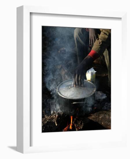 A Man, 24, from Ghana, Prepares His Meal-null-Framed Photographic Print