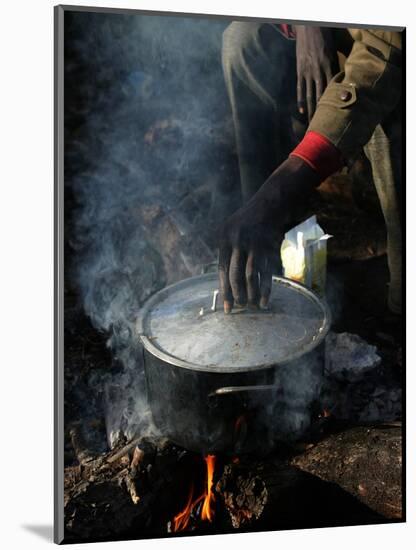 A Man, 24, from Ghana, Prepares His Meal-null-Mounted Photographic Print