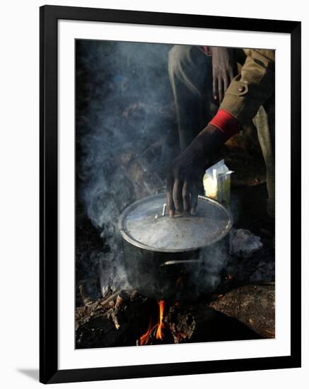 A Man, 24, from Ghana, Prepares His Meal-null-Framed Photographic Print