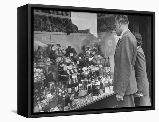 A Man Browsing in a Butcher Shop-null-Framed Stretched Canvas