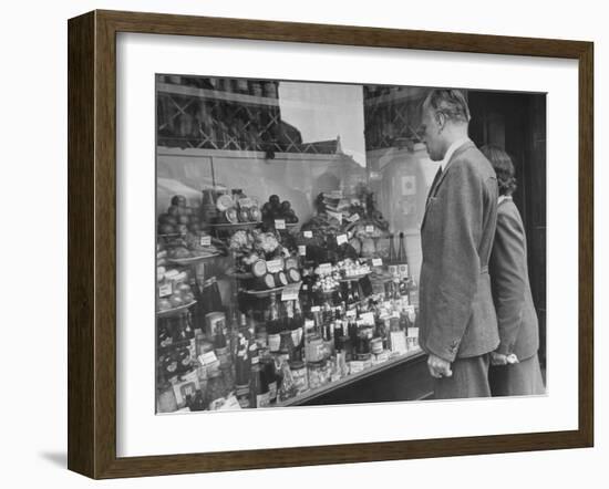 A Man Browsing in a Butcher Shop-null-Framed Photographic Print