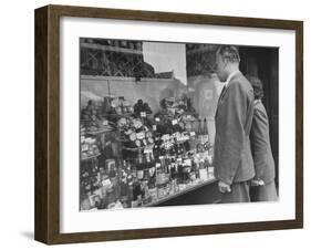 A Man Browsing in a Butcher Shop-null-Framed Photographic Print