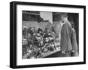 A Man Browsing in a Butcher Shop-null-Framed Photographic Print