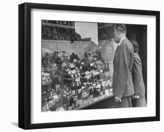 A Man Browsing in a Butcher Shop-null-Framed Photographic Print