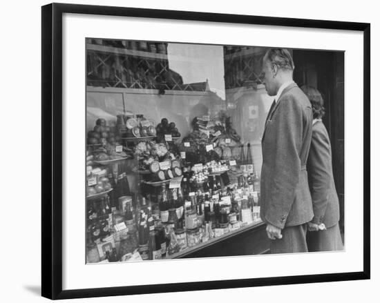 A Man Browsing in a Butcher Shop-null-Framed Photographic Print