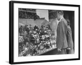 A Man Browsing in a Butcher Shop-null-Framed Photographic Print