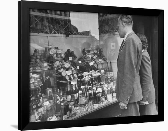 A Man Browsing in a Butcher Shop-null-Framed Photographic Print