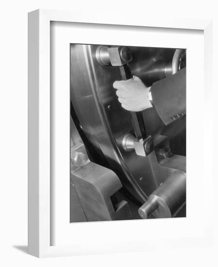A Man Closes a Large Bank Vault-Philip Gendreau-Framed Photographic Print