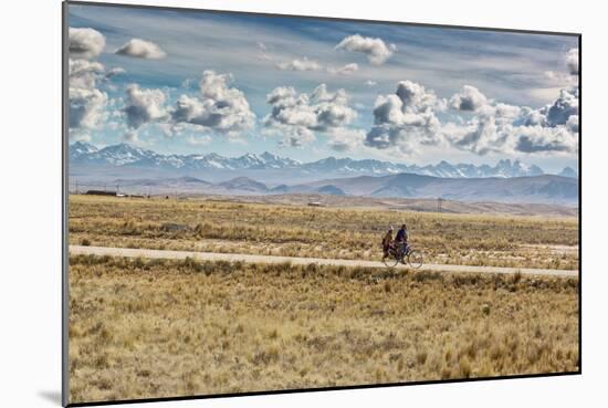 A Man Cycles with a Family Member on the Back of His Bicycle Between La Paz and Tiwanaku-Alex Saberi-Mounted Photographic Print