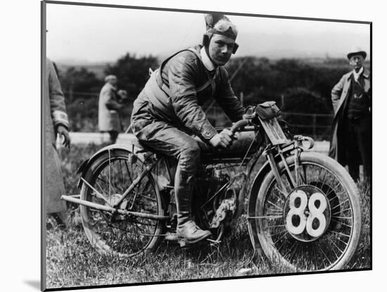 A Man Dressed in Leathers on a Harley-Davidson-null-Mounted Photographic Print