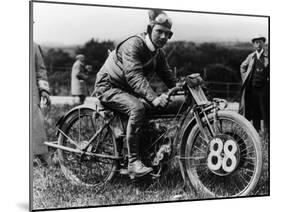 A Man Dressed in Leathers on a Harley-Davidson-null-Mounted Photographic Print