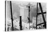 A Man Hangs Precariously from a Line During the Construction of a Skyscraper in New York-null-Stretched Canvas