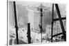 A Man Hangs Precariously from a Line During the Construction of a Skyscraper in New York-null-Stretched Canvas