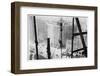 A Man Hangs Precariously from a Line During the Construction of a Skyscraper in New York-null-Framed Photographic Print