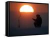A Man Icefishes on the Frozen Finnish Gulf at Sunset Outside St.Petersburg-null-Framed Stretched Canvas