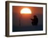 A Man Icefishes on the Frozen Finnish Gulf at Sunset Outside St.Petersburg-null-Framed Photographic Print