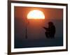 A Man Icefishes on the Frozen Finnish Gulf at Sunset Outside St.Petersburg-null-Framed Photographic Print