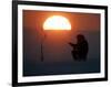 A Man Icefishes on the Frozen Finnish Gulf at Sunset Outside St.Petersburg-null-Framed Photographic Print