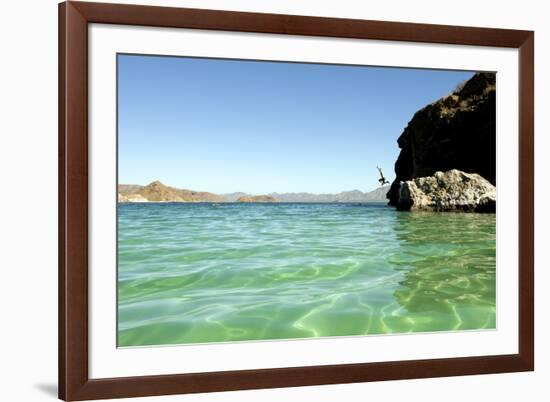 A Man Jumps into a Bay Near Loreto, Baja Sur, Mexico-Bennett Barthelemy-Framed Photographic Print