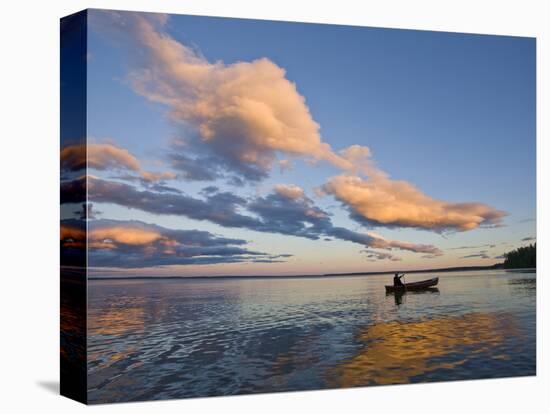 A Man Paddles a Canoe at Sunset on Lake Sebago.-Sergio Ballivian-Stretched Canvas