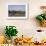 A man paddles his canoe past one of the floating villages on Inle Lake, Myanmar (Burma), Asia-Alex Treadway-Framed Photographic Print displayed on a wall