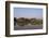 A man paddles his canoe past one of the floating villages on Inle Lake, Myanmar (Burma), Asia-Alex Treadway-Framed Photographic Print