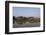 A man paddles his canoe past one of the floating villages on Inle Lake, Myanmar (Burma), Asia-Alex Treadway-Framed Photographic Print