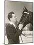 A Man Petting His Horse-null-Mounted Photo