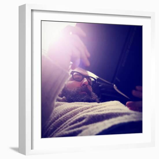 A Man Reading a Book-graphicphoto-Framed Photographic Print