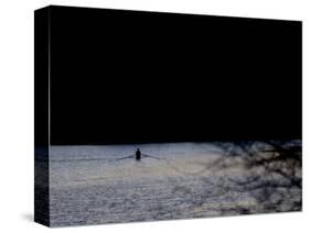 A Man Rows His Scull on Carnegie Lake-null-Stretched Canvas