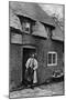 A Man Smoking a Pipe Outside a Shop, Worcestershire, C1922-AW Cutler-Mounted Giclee Print