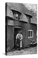 A Man Smoking a Pipe Outside a Shop, Worcestershire, C1922-AW Cutler-Stretched Canvas