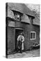 A Man Smoking a Pipe Outside a Shop, Worcestershire, C1922-AW Cutler-Stretched Canvas