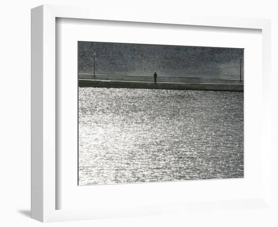 A Man Stands on the Banks of a Small Lake, Munich, on Friday, November 3, 2006.-Christof Stache-Framed Photographic Print