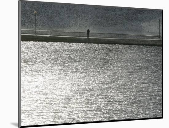 A Man Stands on the Banks of a Small Lake, Munich, on Friday, November 3, 2006.-Christof Stache-Mounted Photographic Print