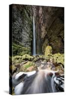 A Man Stands under Cachoeira Fumacinha Waterfall in Chapada Diamantina National Park-Alex Saberi-Stretched Canvas