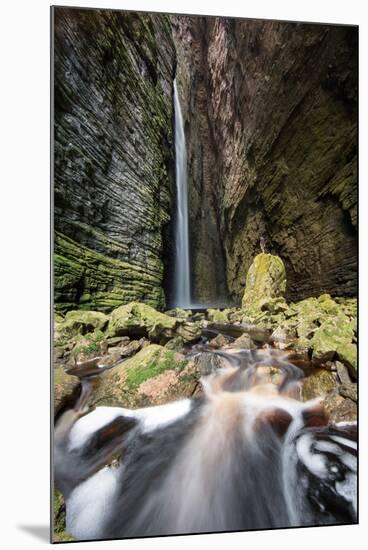 A Man Stands under Cachoeira Fumacinha Waterfall in Chapada Diamantina National Park-Alex Saberi-Mounted Photographic Print