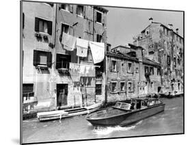 A Man Takes His Boat Through the Canal-null-Mounted Photographic Print