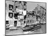 A Man Takes His Boat Through the Canal-null-Mounted Photographic Print