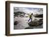 A Man Uses His Trekking Poles to Hop across a Lake in the Southern Wind River Range in Wyoming-Sergio Ballivian-Framed Photographic Print