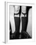 A Man Using "Sock Suspenders" to Hold Up His Socks; in America They are Called Garters-null-Framed Photographic Print