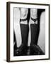 A Man Using "Sock Suspenders" to Hold Up His Socks; in America They are Called Garters-null-Framed Photographic Print