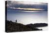 A Man Walks Along a Rocky Crest Above Lake Titicaca in Bolivia During Sunset-Sergio Ballivian-Stretched Canvas