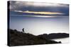 A Man Walks Along a Rocky Crest Above Lake Titicaca in Bolivia During Sunset-Sergio Ballivian-Stretched Canvas