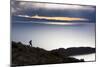 A Man Walks Along a Rocky Crest Above Lake Titicaca in Bolivia During Sunset-Sergio Ballivian-Mounted Photographic Print
